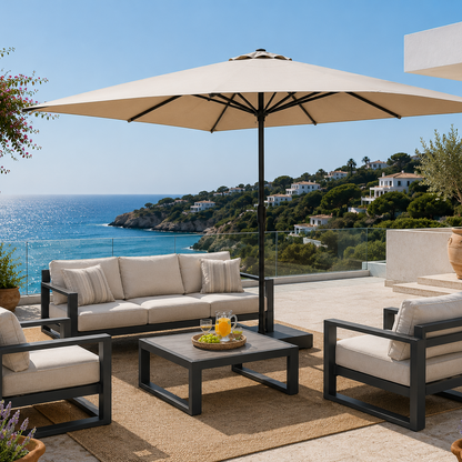 Outdoor patio set with beige cushions, umbrella, and coffee table on a scenic overlook.